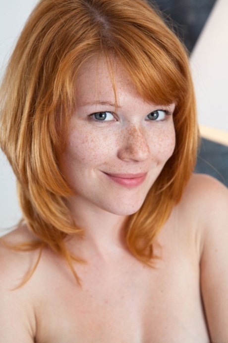 Czech teen Mia Sollis displays her cute freckled face & bald pussy up close