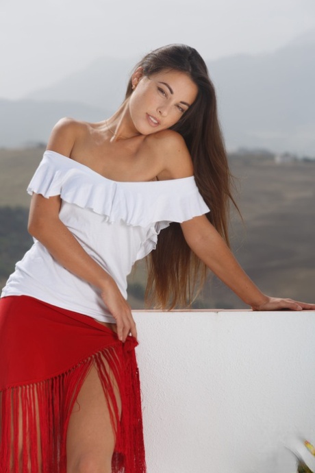 Sweet teen with long brunette hair Lorena B flaunts her trimmed clam outdoors