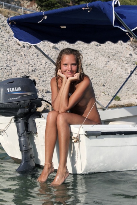 Teenage stunner Mango A strips naked on a boat & shows her hot tanned body