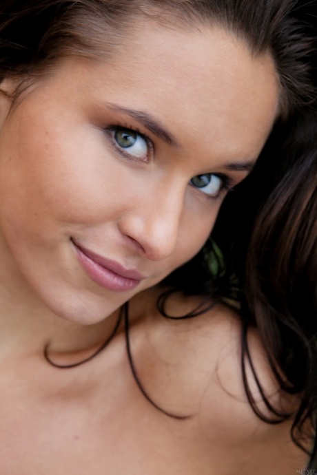 Glamorous brunette Diana G shows her tiny tits & her shaved pussy outdoors
