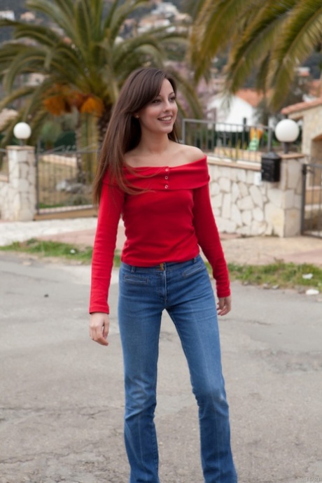 Gorgeous teen Lorena B doffs her shirt and jeans and poses naked in a solo