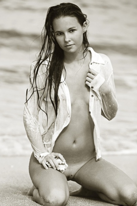 Teen Aria A poses nude on the sandy beach & shows her hot body with tan lines