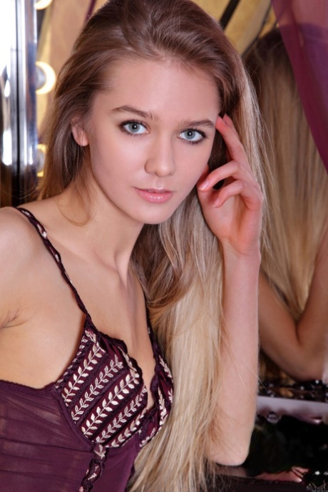 Beautiful teen Sara B undresses & shows off her slender naked body