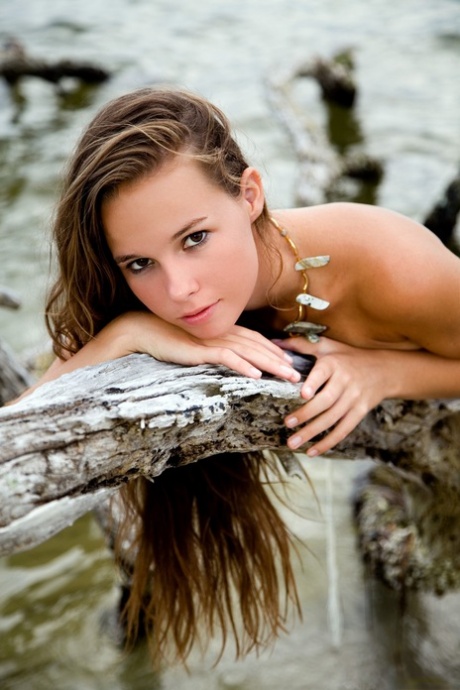 Glamorous teen Aria A displays her hot body with tan lines on the beach