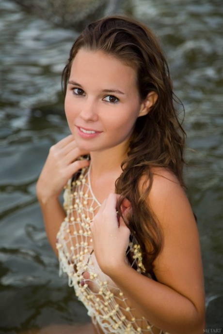 Glamorous teen Aria A displays her hot body with tan lines on the beach