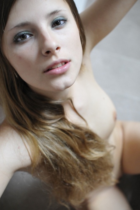 Long-haired glamour babe Alba A strips naked & shows off her big ass