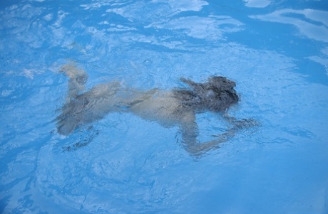 Teens Iveta B & Yana B lose their bikinis and swim butt naked in the pool