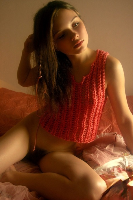 Delightful brunette teen Anna S teases with her hairy pussy and small tits