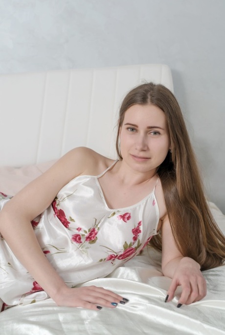 Sexy Ukrainian teen Lady Di takes off her nightie & shows off her bald pussy