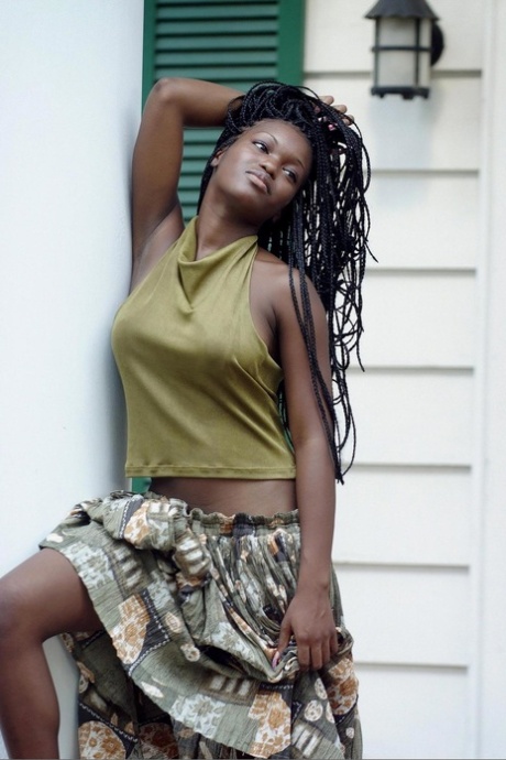 Sexy ebony teen Deserea bares her great natural big tits outdoors
