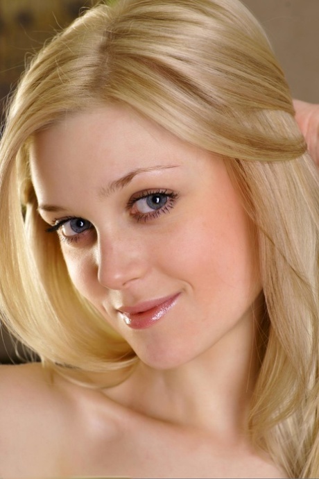 Blonde babe Olesa shows off her skinny body while totally naked