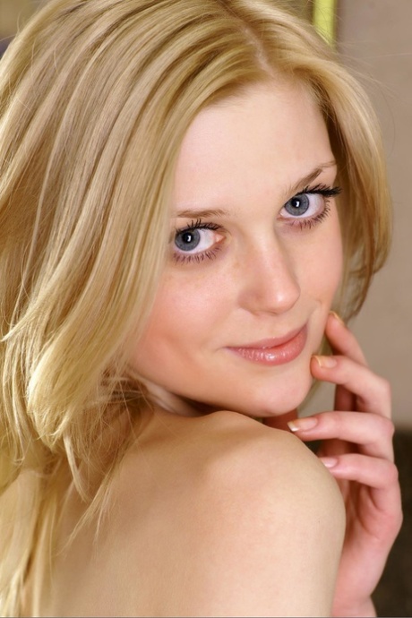 Blonde babe Olesa shows off her skinny body while totally naked