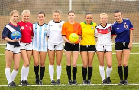 Kinky soccer babes strip each other and flaunt their titties on a soccer pitch