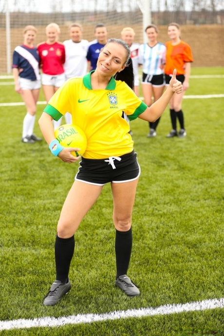 Kinky soccer babes strip each other and flaunt their titties on a soccer pitch