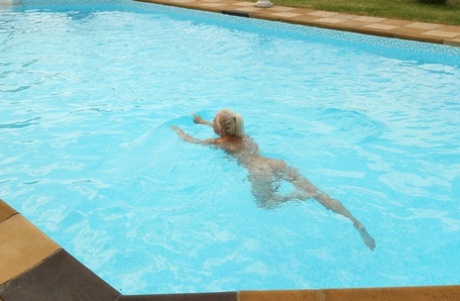 Sweet blonde teen Lola exposes her hot body before peeing poolside