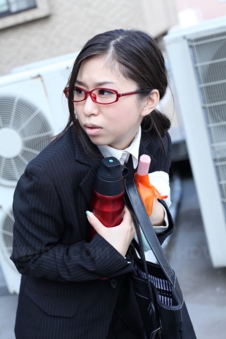 Japanese businesswoman Yuka Tsubasa gives an intense footjob & handjob