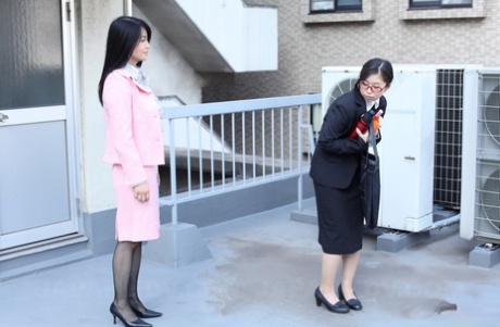 Japanese businesswoman Yuka Tsubasa gives an intense footjob & handjob