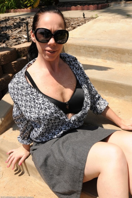 MILF Kira I does a sexy striptease after flashing an upskirt in public