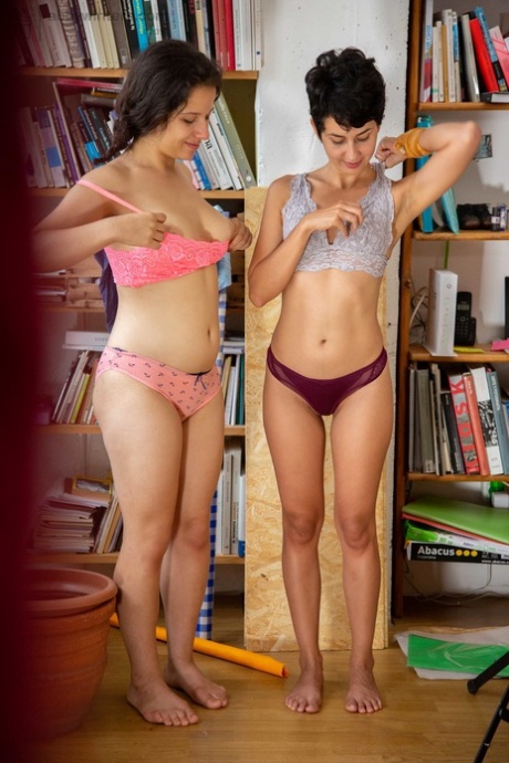 Kinky amateur lesbians Anais V & Alessia swapping clothes in the library