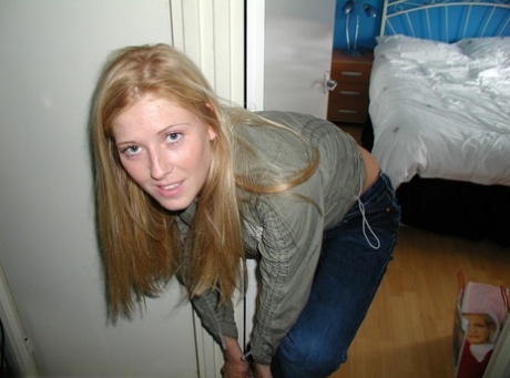 Amateur blonde with big tits Michelle B shows her curves wearing red underwear
