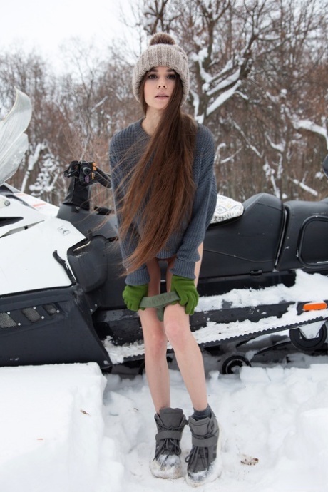 Russian teen Leona Mia shows her sweet pussy & natural tits while snowmobiling