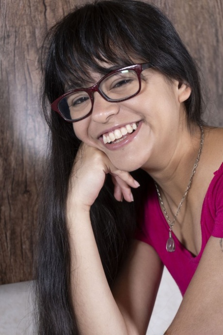 Nerdy cutie in glasses Joaquina unveils her hairy twat & poses in the kitchen