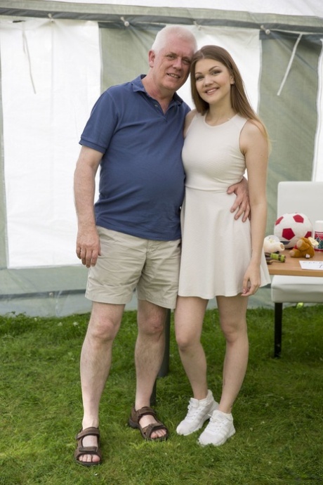 Horny Russian teen Amanda Clarke having sex with an old man in an outdoor tent
