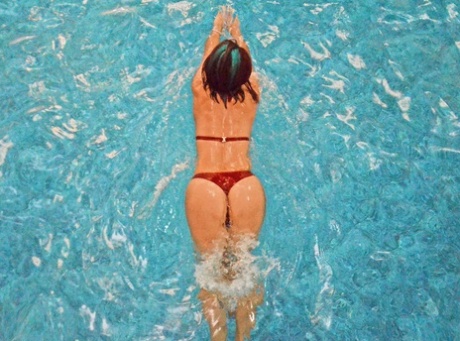 Amateur babe Just Sofia shows off her big ass while posing in her bikini