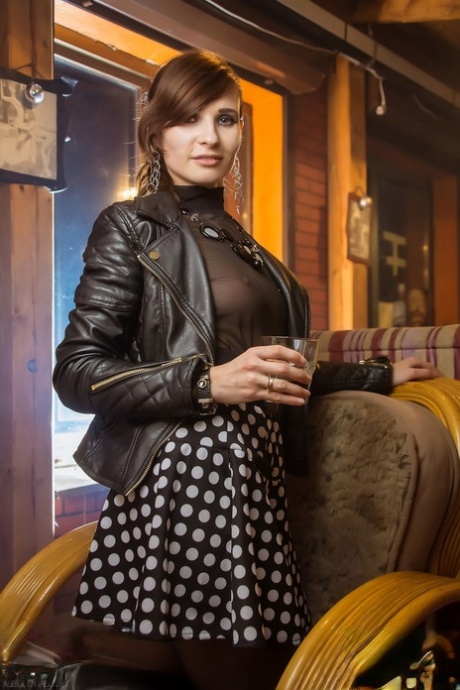 Sexpot in boots Jeny Smith gives an arousing upskirt in pantyhose in public