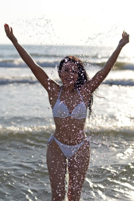 Sexy babe Julia Joy shows her beautiful body wearing a bikini at the beach