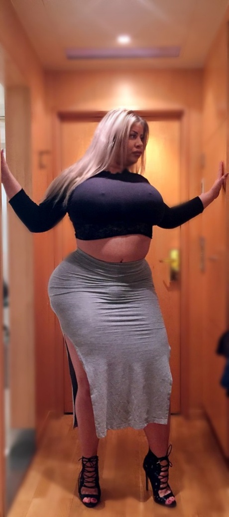 Blonde MILF Natasha Crown shows off her monster bubble booty in her sexy skirt