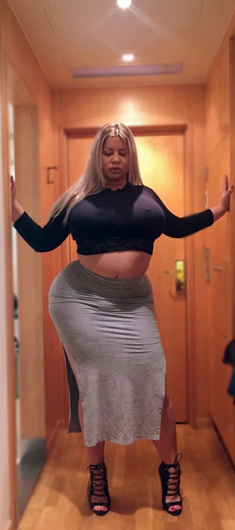 Blonde MILF Natasha Crown shows off her monster bubble booty in her sexy skirt