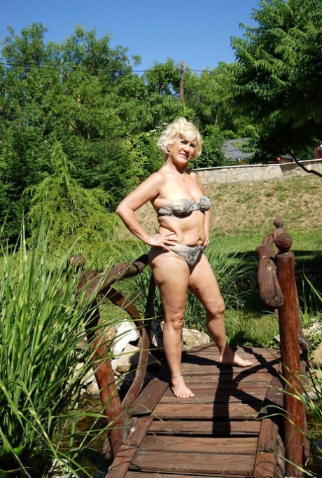 European mature Petunia reveals her chubby body and masturbates indoors