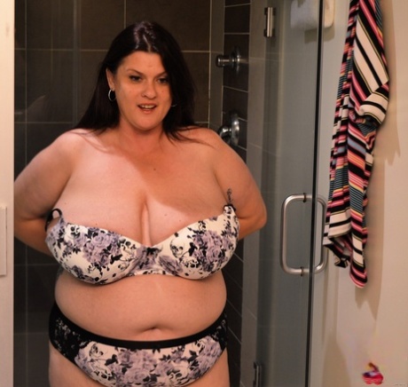 Gorgeous MILF fatty Kimmie Kaboom showering her big natural tits with milk
