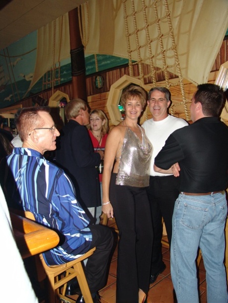 Naughty mature wife Tracy Lick shows off her big tits at a swingers party