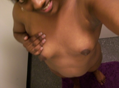 Ebony teen Paris takes selfies while showing her big ass & puffy nipples