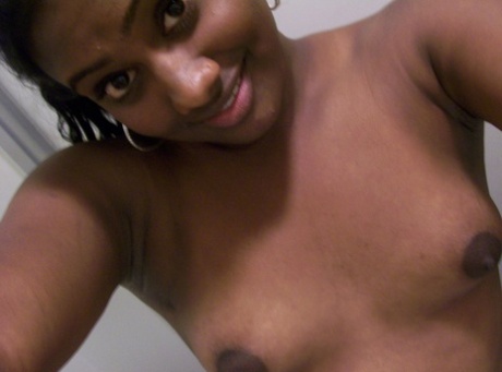 Ebony teen Paris takes selfies while showing her big ass & puffy nipples