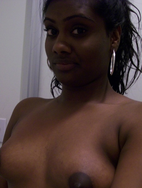 Ebony teen Paris takes selfies while showing her big ass & puffy nipples