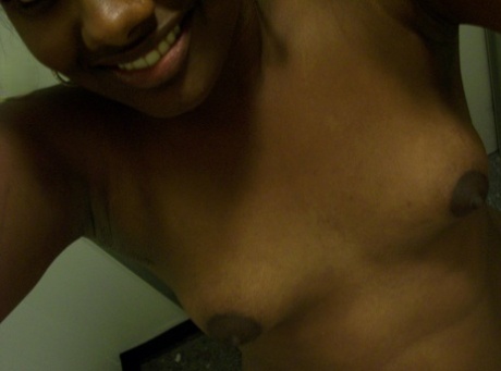 Ebony teen Paris takes selfies while showing her big ass & puffy nipples