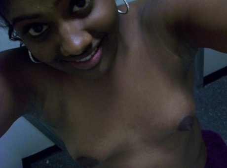 Ebony teen Paris takes selfies while showing her big ass & puffy nipples