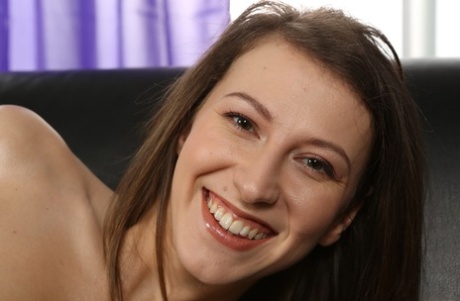 Sweet brunette with natural tits Nicoleta toys her pussy after stripping
