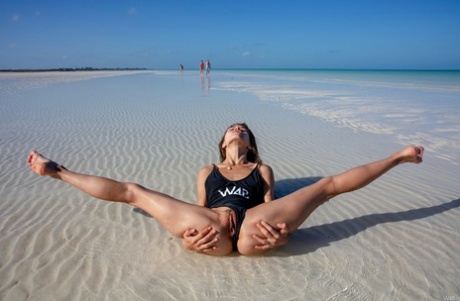 Colombian teen Irene Rouse shows off her flexible naked body outdoors