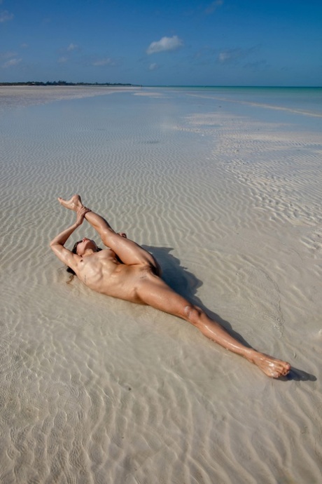 Colombian teen Irene Rouse shows off her flexible naked body outdoors