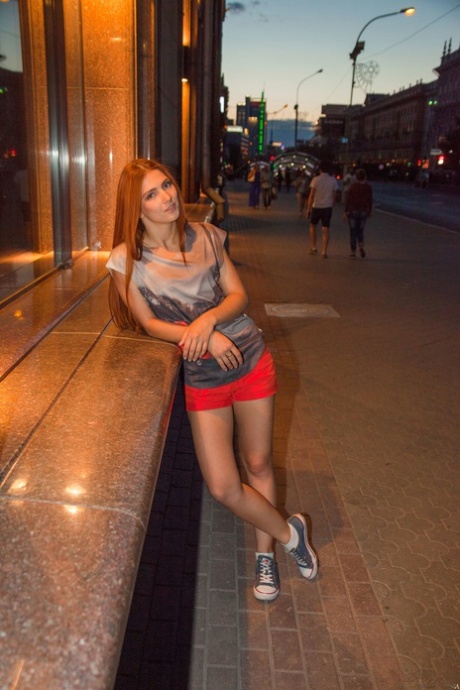 Redheaded teen with a slim body Carinela shows her flexibility naked
