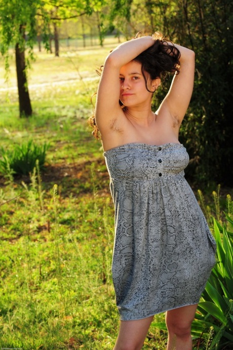 Curvy amateur teen Mia unveils her big boobs and rubs her bush in nature