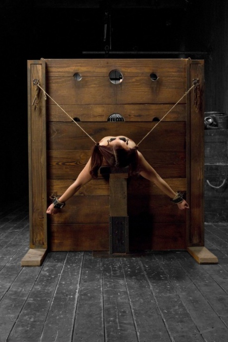 Redhead MILF Josi gets her tight pussy fisted in stock & pillory BDSM action