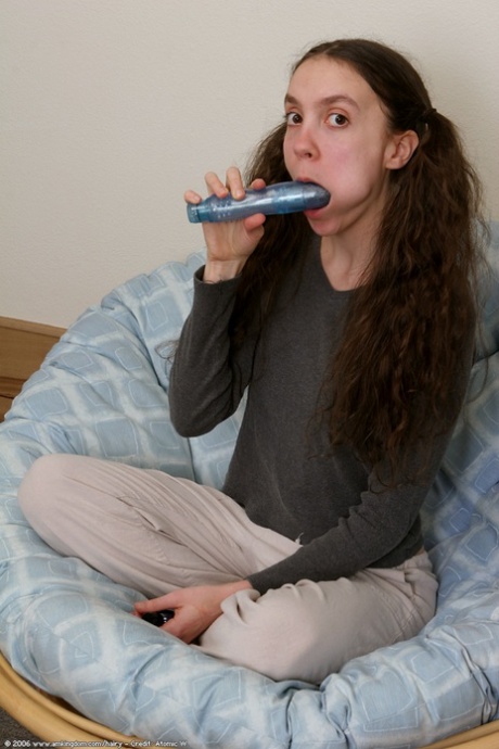 Brunette teen with pigtails Cameron exposes her big nips and toys her cunt