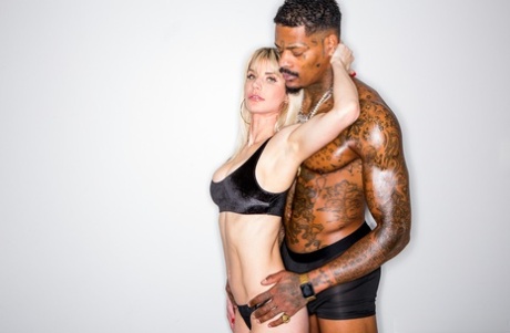 Blonde hottie with big tits Cassie Bender licking & fucking a big black cock