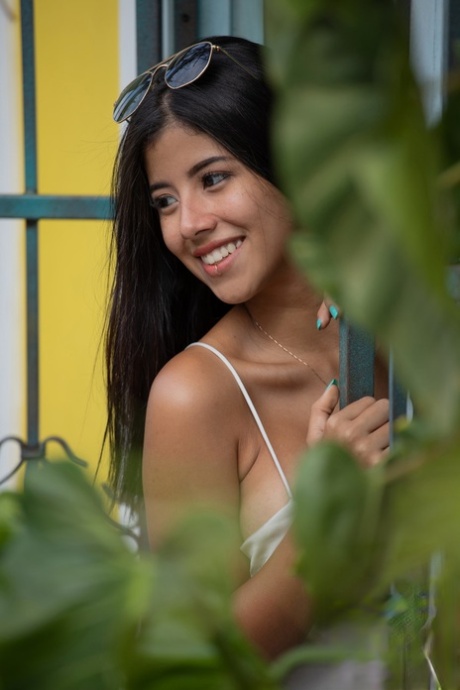 Pretty Latina with a leg tattoo Iris Lucky presents her big tits & masturbates