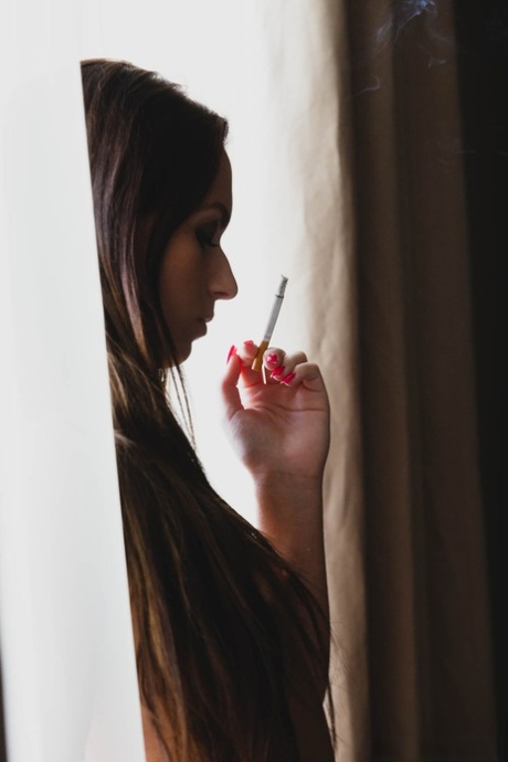 Spanish teen Nata Lee masturbates in her stockings after smoking a cigarette